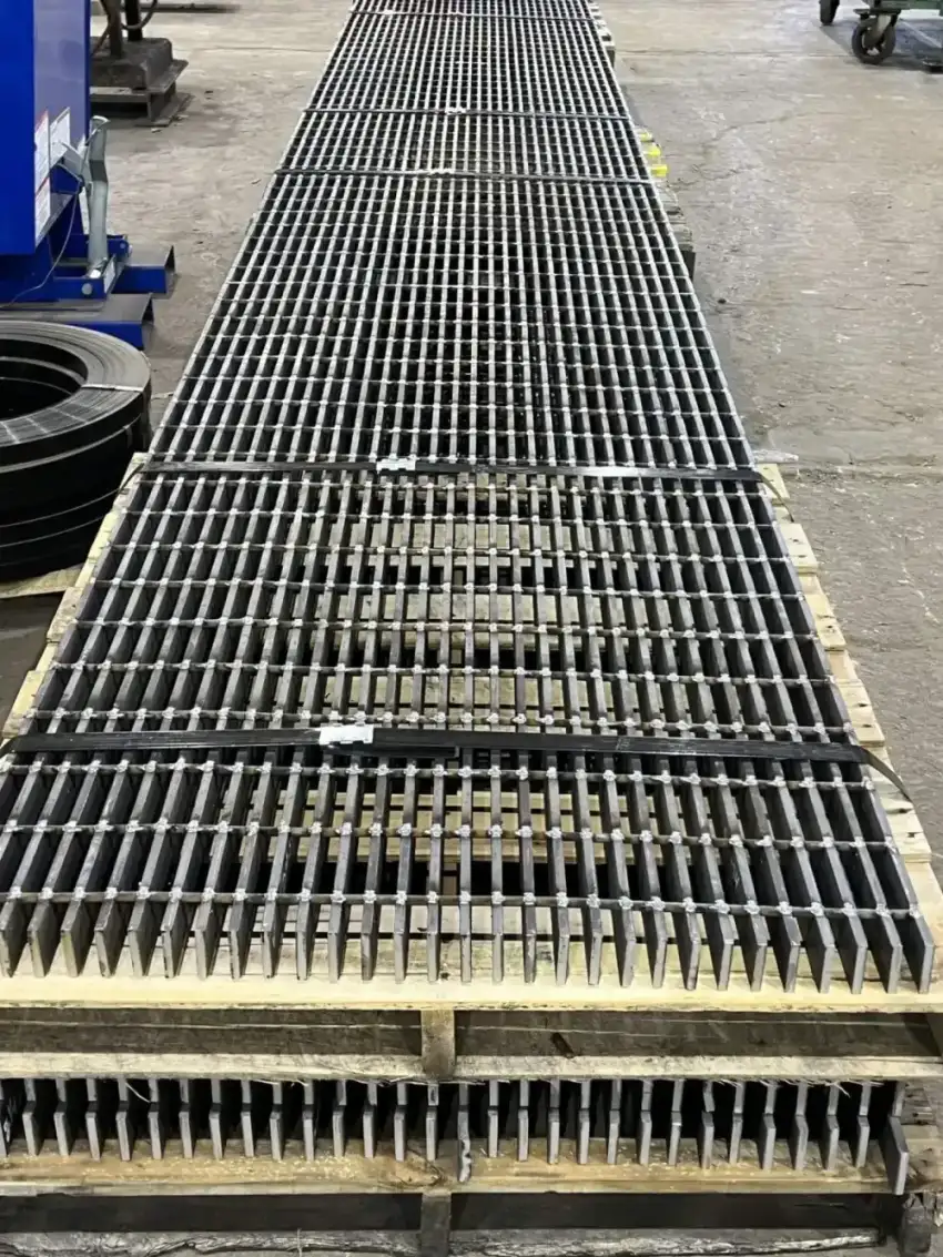 Grating deck pedestrian bridge over road