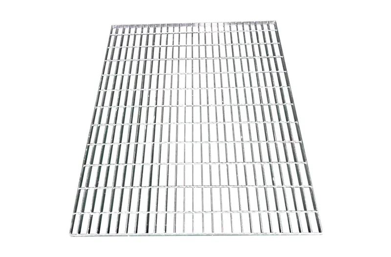 Close-up of bolted galvanized grating plank on large industrial outdoor installation; sunny day