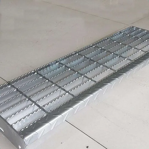 Weathered welded steel grating platform on steel substructure over industrial yard; elevated wide view