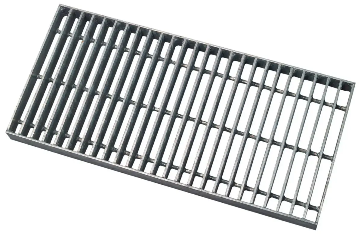 Worker welding steel grating with sparks visible