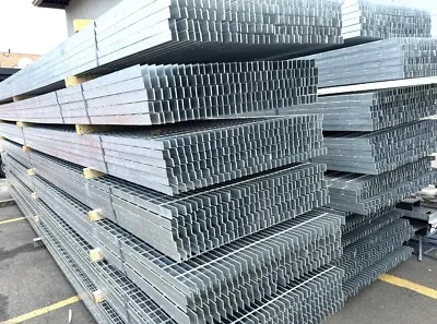Steel bar grating — Bundles of flat steel bars (raw material) stacked in factory warehouse