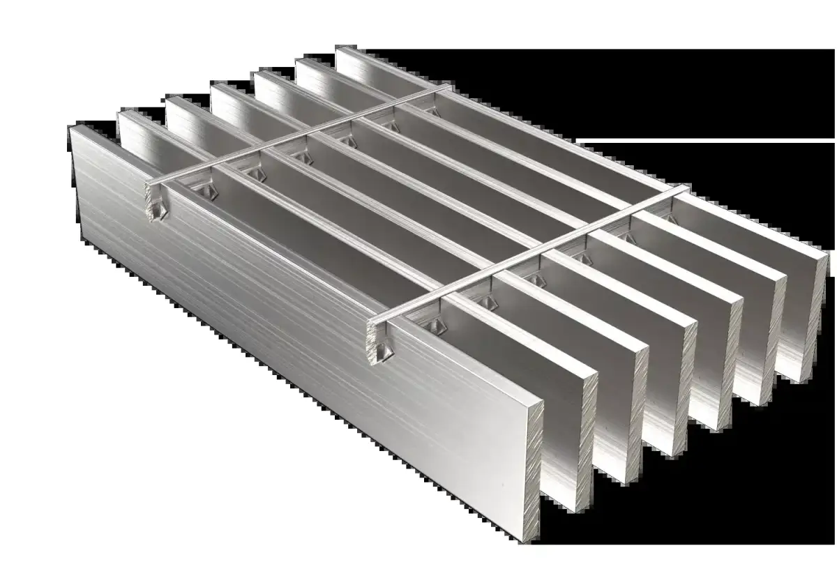Symmetrically stacked galvanized grating bundles in yard with distant building
