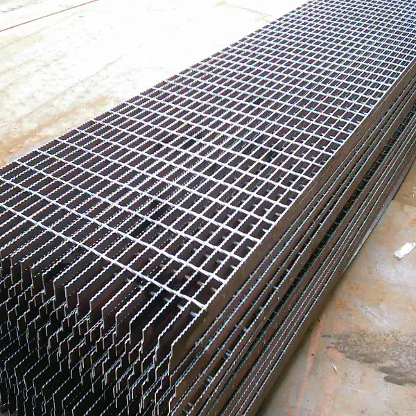 Stainless steel welded grating panel detail with brushed finish; studio lighting