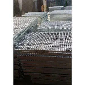 Hand touching brushed stainless steel grating panel; studio close-up