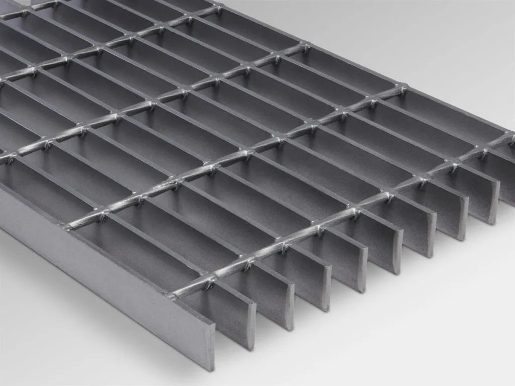 Steel bar grating — Stair tread close-up showing bolted attachment angle bracket and plain bearing bars