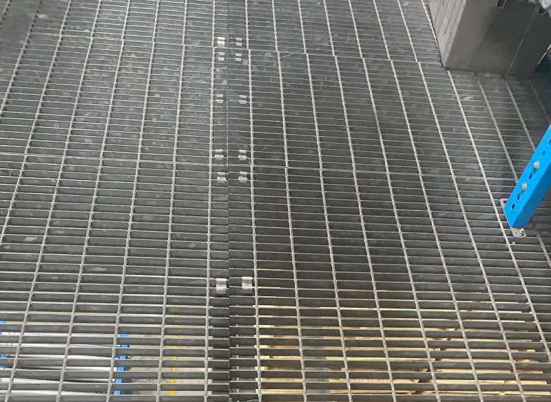 Close-up of welded grating stair tread with checker plate nosing