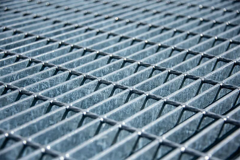 Multi-flight grating staircase in industrial plant; low angle