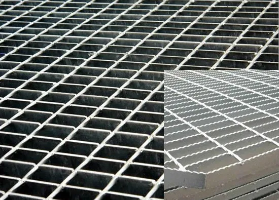 Aerial view of curved trench drain channels covered by steel grating drain covers along road/industrial site