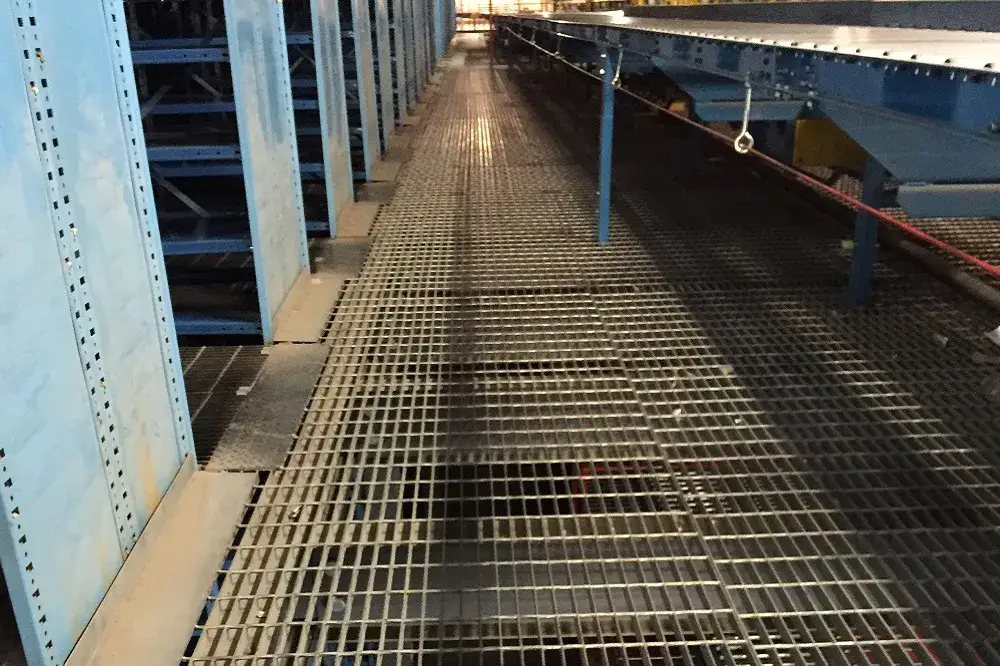 Small trench drain grate frame near curb
