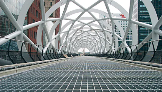 Drainage grating channel with frame along concrete apron
