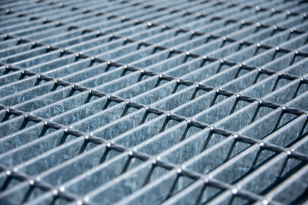 Welded steel bar grating close-up; galvanized; white background