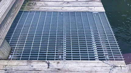 Welded steel bar grating close-up; galvanized; white studio background