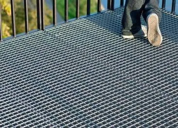 Rectangular galvanized welded grating panel; three-quarter view on white background