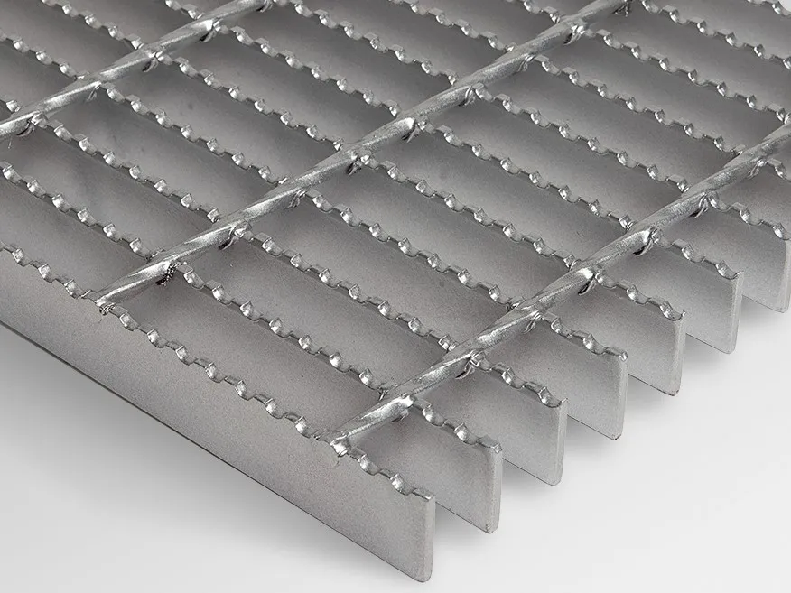 Welded steel bar grating with flame-cut unbanded bar ends; galvanized; slight angle on white background