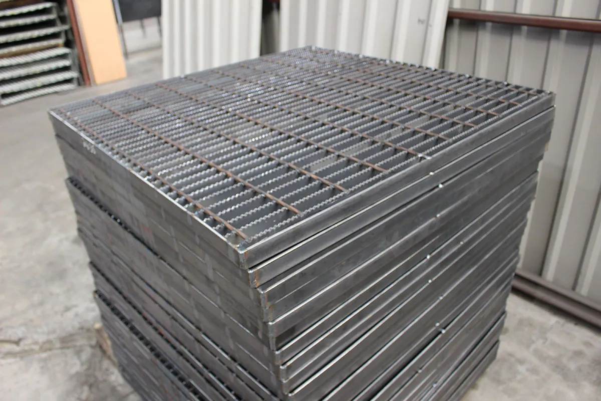 Welded steel bar grating diagonal view on white background with twisted square cross bars