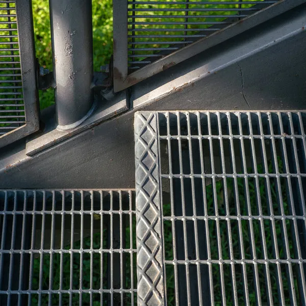 Welded steel bar grating close-up; galvanized; white studio background