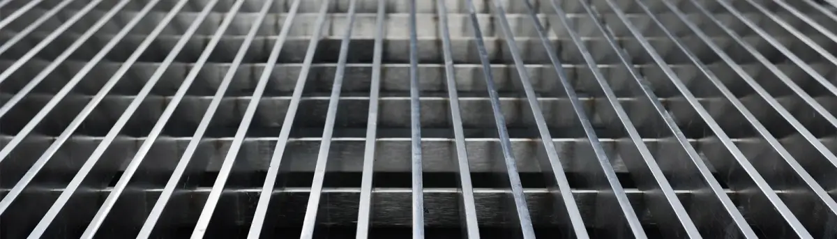 Stack of painted black grating panels