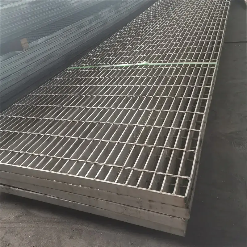 Welded steel bar grating with twisted square cross rods; galvanized; low three-quarter view on white background
