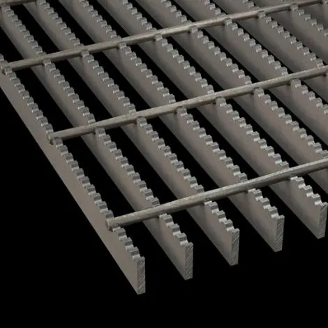 Serrated welded steel grating close-up showing saw-tooth bearing bar edges and round cross rods; black background