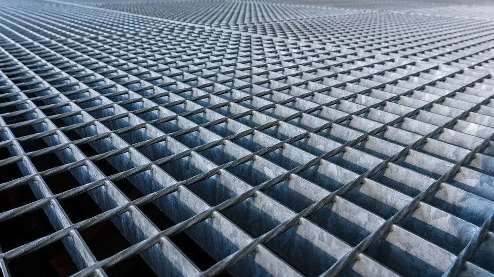 Serrated anti-slip grating surface close-up at angle