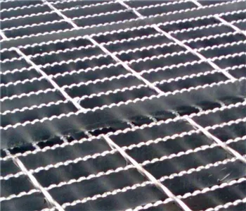 Macro close-up of serrated welded grating surface showing saw-tooth anti-slip edges