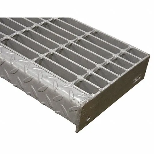 Welded steel bar grating close-up; flat bearing bars with twisted square cross rods; white studio background